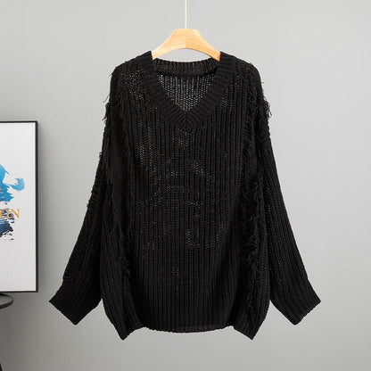 Top suelto de mujer, manga larga, escote en V con borlas.