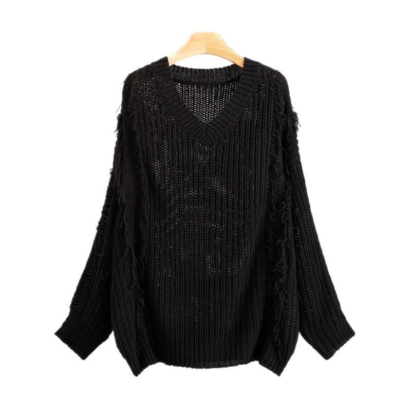 Top suelto de mujer, manga larga, escote en V con borlas.